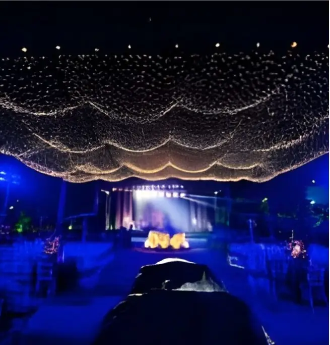 Night reception under a fairy-light canopy